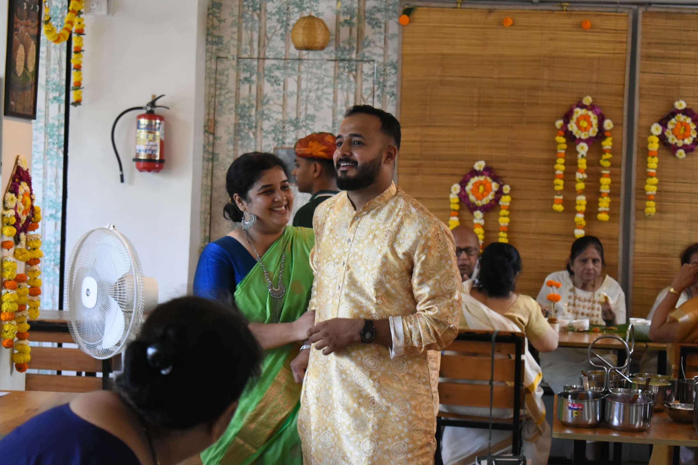Guests arriving in festive colours for Bhoomi's Onam Sadhya