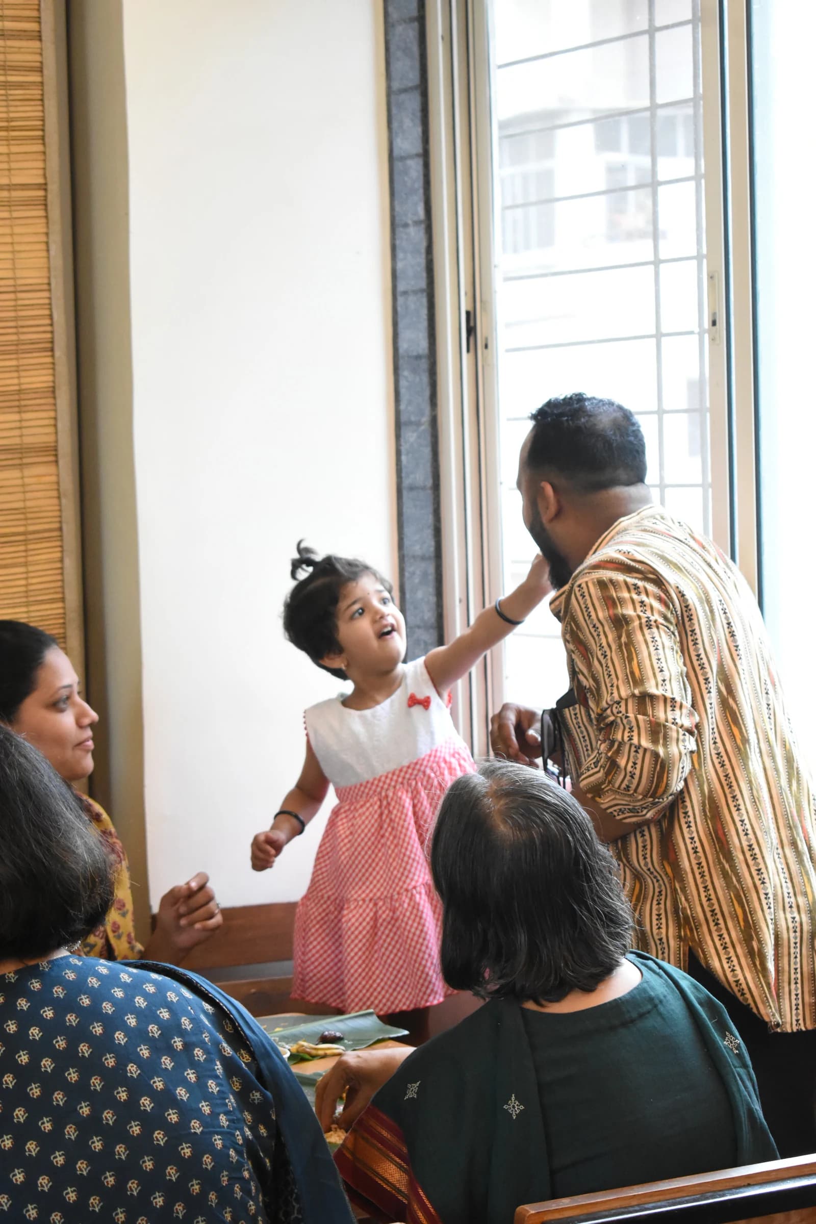 A young family enjoying a festive gathering at Bhoomi