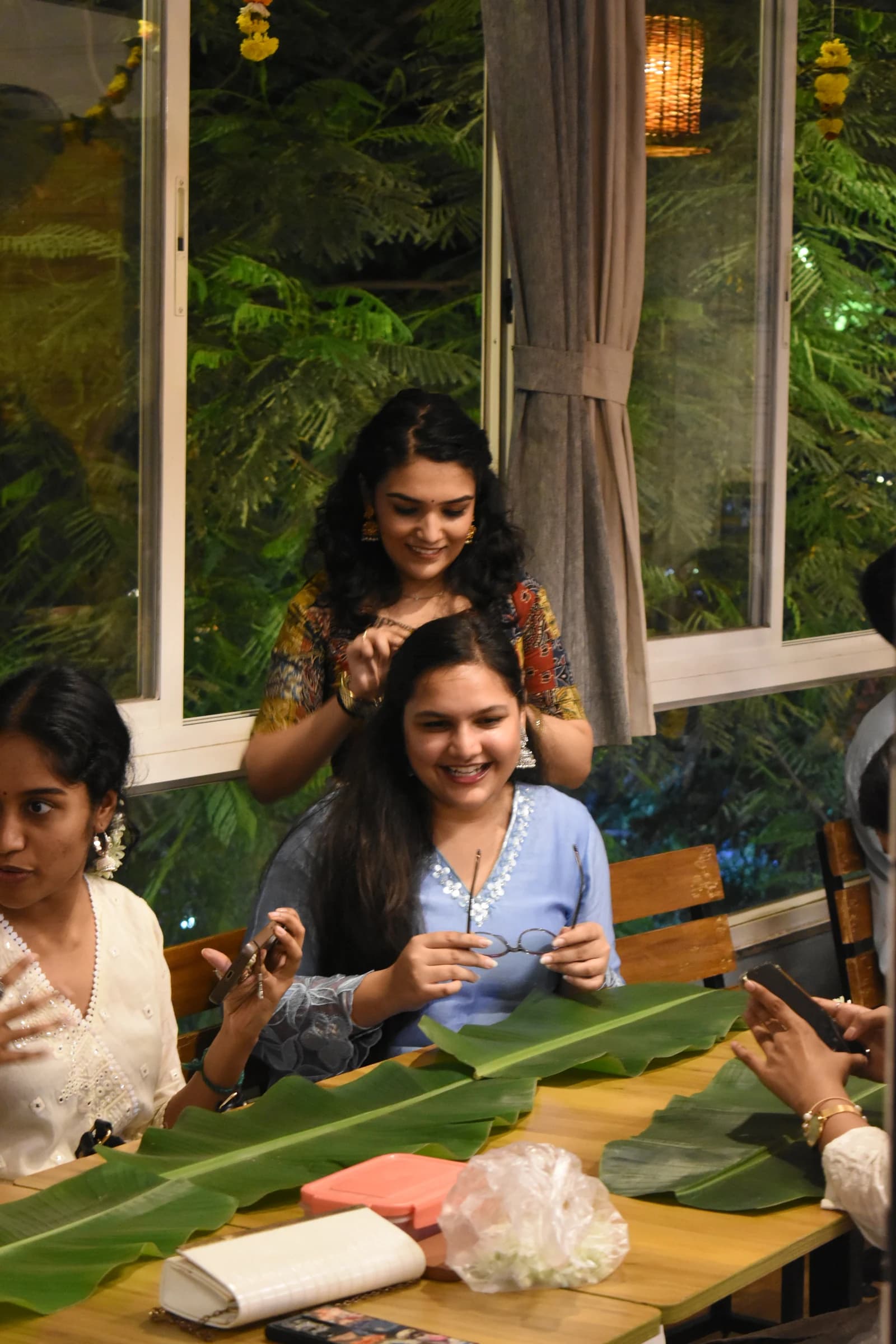 Laughter around a family table during the Onam celebration